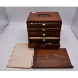 A vintage Mah-Jong set in hardwood case, the interior with five drawers, steel carrying handle,