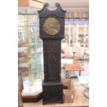 A George III oak longcase clock, having a brass dial, with later carving to case, plus weights and