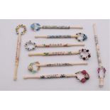 A collection of eight bone  lace bobbins, all with hand painted decoration, comprising: three by