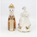 A Royal Doulton figure of the month of December HN2696, plus a Royal Crown Derby figure of Royal