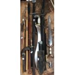Collection of reproduction swords, daggers and other bladed weapons from history with a reproduction