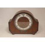 A Clarke and Co walnut veneered eight day mantel clock, having a Westminster chime