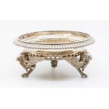 A late Victorian silver centre piece, semi fluted raised on three griffin supports, London 1886,