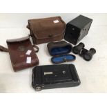 Two vintage cased cameras along with early 20th century cased theatre glasses.