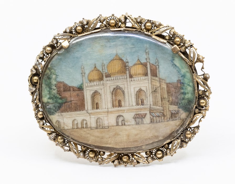 A fine large 19th century Indian gold backed brooch, oval in form with a decorative filigree and