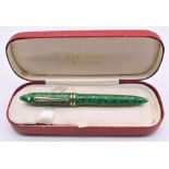 Sheaffer, Balance, a green marbled fountain pen, the nib stamped 18K Feather Touch, in a red