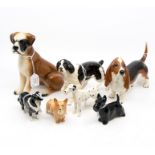 A collection of Beswick animal figures, comprising of black and white parador, a collier dog, a