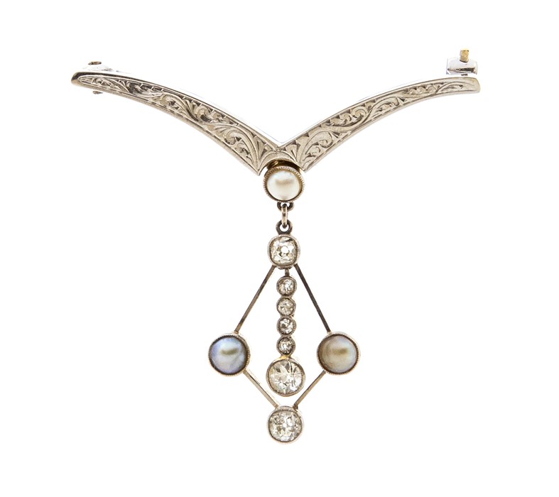An Edwardian diamond and pearl set platinum and gold brooch, comprising an engraved wish bone shaped - Image 2 of 2