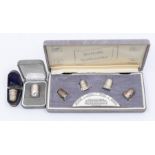 Silver thimbles - a cased set of four silver thimbles, representing the four assay offices; together