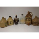 A Collection Of Flagons And Beer Jugs, Comprising of Three Plastic Flagons A Glass Jug And two