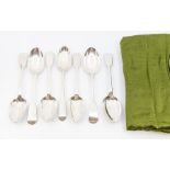 A collection of silver fiddle pattern table spoons to include: four Victorian and two early 20th