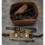 A collection of 19th & 20th Century horse brasses mainly mounted on leather martingale straps,