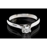 A diamond and platinum solitaire ring, comprising a brilliant cut diamond, weighing approx 0.40ct,