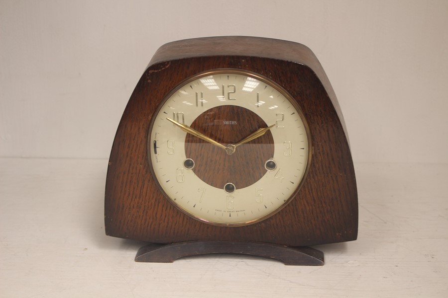 A mid 20th Century Smiths eight day oak cased mantel clock, circa 1960, having three winder holes,