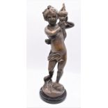 Bronzed figure of Putto on marble stand 40cm H.