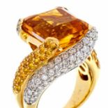 A citrine, diamond and yellow sapphire 18ct gold ring, comprising a square cut citrine claw set to