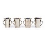A set of four George V silver tots in the form of three handled tygs, by Alexander Clark & Co.,