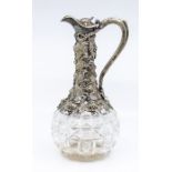 A Victorian style plate mounted glass claret jug, the body applied with vine leaf and grape mount,