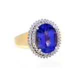 A tanzanite and diamond 18ct gold ring, comprising an oval tanzanite approx 5.12carats, claw set