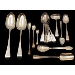 A collection of silver flatware including fiddle and Old English pattern spoons and a stilton scoop,