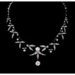 A diamond Necklace/Tiara comprising three detachable sections, mounted as one length on a base metal