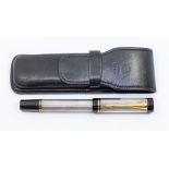 A Parker Duofold Centennial fountain pen, silver coloured godron patterned barrel and cap, black