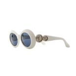 A pair of vintage Gianni Versace white framed ladies sunglasses, circa 1990's, iconic logo to
