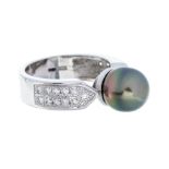 A Tahitian pearl and diamond 18ct white gold dress ring, comprising a round green tone cultured