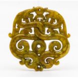 A 20th century jade disc, carved and pierced, approx 7cm x 7cm