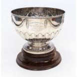 Agricultural Interest: A Victorian silver large punch bowl, the body chased with swags above gadroon