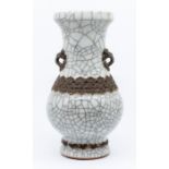 A Chinese baluster vase, 20th century, the body covered with a pale grey crackled glaze, with two
