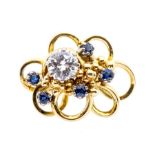 A diamond and sapphire 18ct gold fancy dress ring, comprising a claw set round brilliant cut diamond