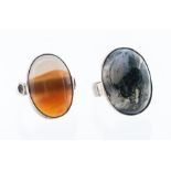 Two silver stone set rings, comprising a silver and moss agate ring, oval cabochon stone approx 17 x