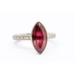 A rubellite tourmaline and diamond set 18ct white gold dress ring, comprising a marquise cut rub