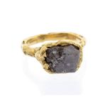 A rough cut cinnamon/black diamond 18ct gold ring, the irregular non faceted rough diamond