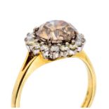 A cinnamon diamond and 18ct gold cluster ring, comprising a central brilliant cut cinnamon diamond