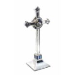 An Arts & Crafts silver mounted cross with enamel decoration in the manner of Edward Spencer for