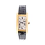 Cartier. An 18ct gold Tank Americaine automatic calendar wristwatch, Reference: 1725, silvered