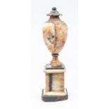 An early 19th century Derbyshire Blue John pedestal urn, integrated cover, ball finial, spreading