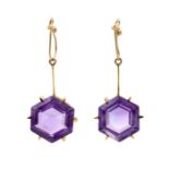 A pair of amethyst  gold drop 14ct gold earrings, comprising a hexagon cut amethyst claw set to a