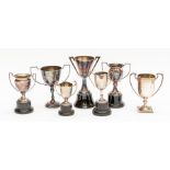 A collection of three early 20th Century small two handled trophies, various dates and makers,