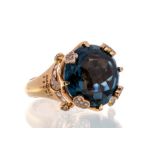 A blue topaz and diamond 18ct rose gold dress ring by Pasquale Bruni, comprising a large cabochon