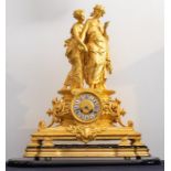 A good large ormolu gilded table clock under glass dome. Depicting two young ladies holding hands