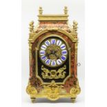 Dutch Tortoise Shell Mantel Clock with brass inlays enamel numerals Movement chiming on a gong. By