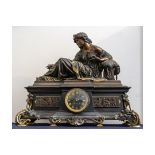 A good large French clock with a bronze reclining lady. Beautifully cast on slate plinth with