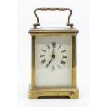 French carriage clock with balance escapement contained in brass case.