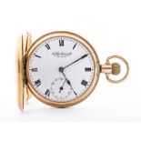 A 9ct gold hallmarked half hunter pocket watch Birmingham 1926, the white enamel dial inscribed "