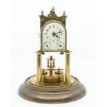 Torsion pendulum or 400-day clock under glass dome, brass base. Dial has calendar months and days.