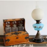 An oil lamp and 19th cent oak cased tantalus