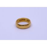 A 22ct gold band, weight approx. 7g